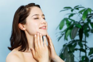 a woman massaging her face