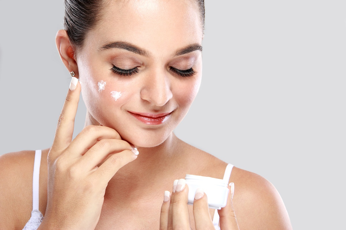 woman applying body butter