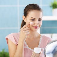 Woman Applying Night Cream