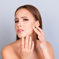 a woman concerned about her skin